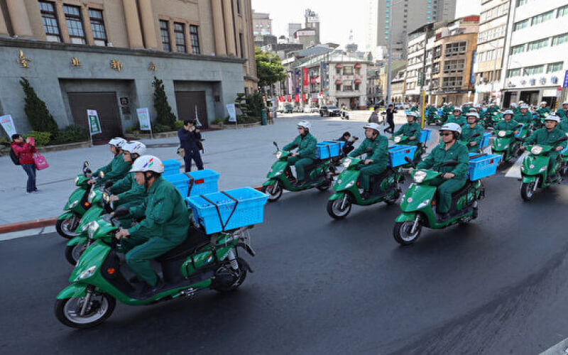 taiwanese postmans are riding Greentrans's e-scooters